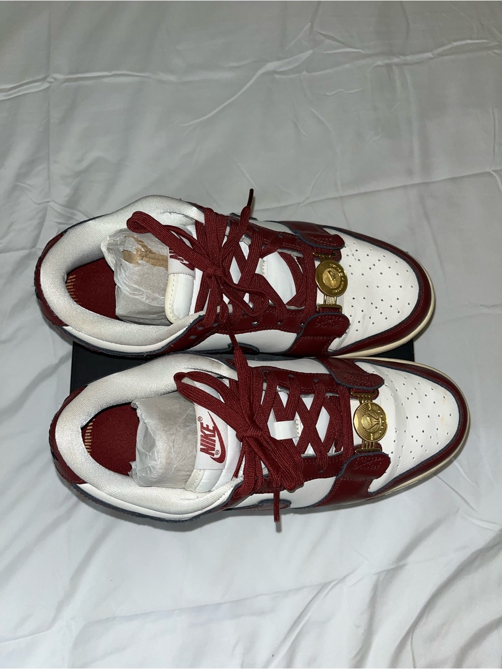 Nike Low-Top Sneakers in White and Burgundy with Gold Accents